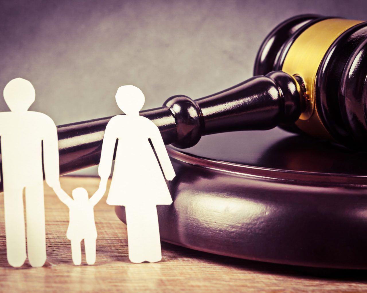 Family figure and gavel on table. Family law concept